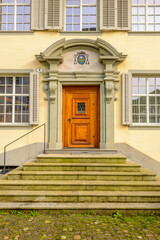Old wooden doors on solid stone building in Lucerne, Switzerland.