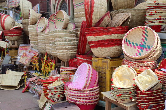 A tribal shop selling a variety of traditional wooden materials and colorful bamboo basket in all sizes.