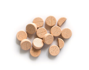 Colored pills on a white background. Round herbal tablets close-up. Healthcare and medicine.