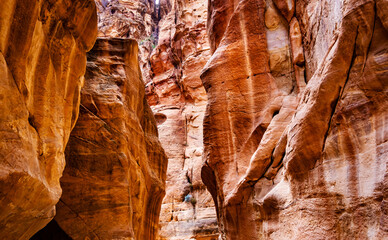 Canyon narrow path way between steep rocks, Petra, Jordan