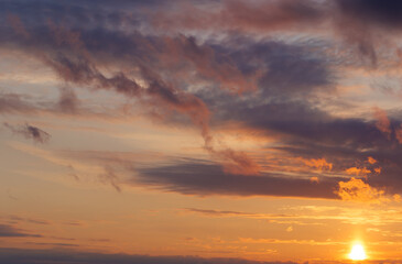 Naklejka premium landscape with a beautiful sunset on a spring meadow
