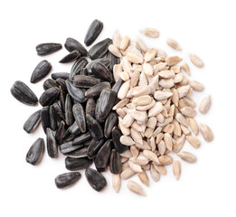 Sunflower seed peeled and not peeled on white background, isolated. The view from top