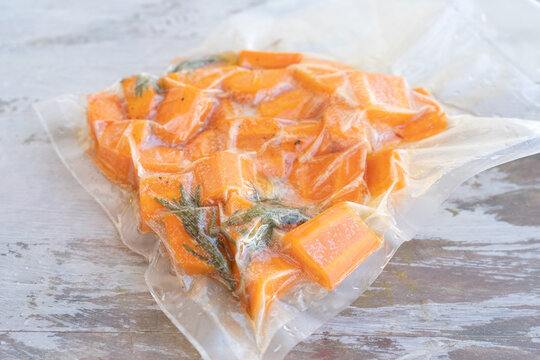 Vacuum sealed bag with carrots ready for low temperature cooking or sous vide