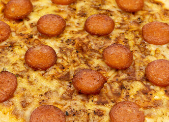 Pepperoni pizza background. Spicy salami and melted cheese.