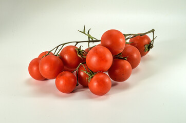 organic cherry tomatoes isolated on white background