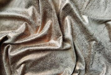 Background, draped fabric in golden, beige color.
