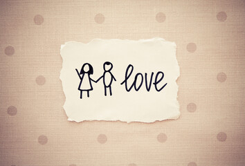 Love word with couple - hand drawn painting card  on vintage background with dots, relationship