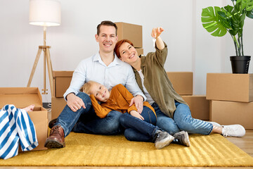 Excited Caucasian Young Family Show Keys To Own Home, Happy To Buy First House Together