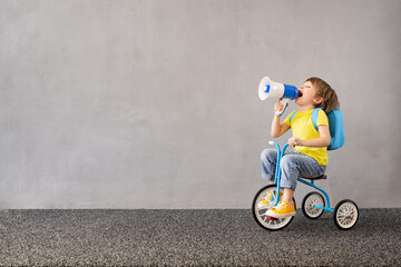 Happy child riding vintage trike