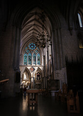 Wonderful gothic Southwark cathedral, London, with coloured windows and gothic arches