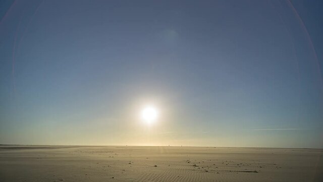 Time lapse of aurora borealis northern lights with milky way and stars from sunset to sunrise on the Dutch island of Texel