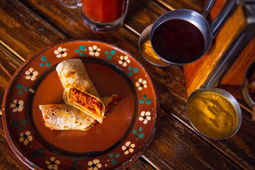 Traditional mexican food. Mexican burrito concept. Mexican burrito with copy space. Mexican food on wooden table. Shawarma concept. Concept of traditional mexican food - obrazy, fototapety, plakaty