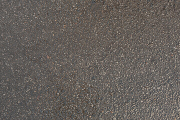abstract background of wet asphalt texture close up