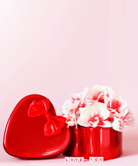 Heart shape gift box and bouquet on pink background.