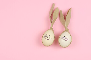 Easter eggs in the form of a rabbit on a pink background with place for text. Easter preparations