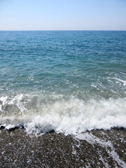 Sea coast and waves in sunny day
