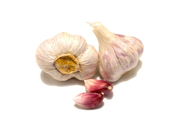 Two heads of garlic and two cloves of garlic. Isolated on white background.