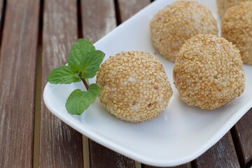 Sesame seed balls or Onde-onde. Indonesian traditional street food. glutinous rice flour stuffed with mung bean paste coated with sesame seeds
