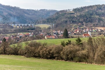 Obraz premium Village in the Czech Republic. Railway bridge over the village Dolni Loucky in the Czech Republic - Europe. Valley with a bridge.