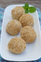 Sesame seed balls or Onde-onde. Indonesian traditional street food. glutinous rice flour stuffed with mung bean paste coated with sesame seeds
