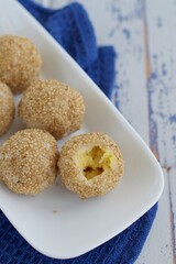 Sesame seed balls or Onde-onde. Indonesian traditional street food. glutinous rice flour stuffed with mung bean paste coated with sesame seeds