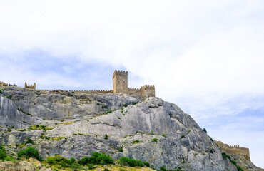 Genoese fortress in the Sudak bay on the Peninsula of Crimea. View from the sea.