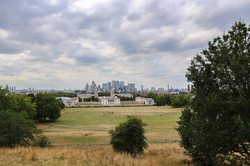 Fototapeta na wymiar London city panorama with high rises in the distance, and Naval University in the first plan photographed from Greenwich