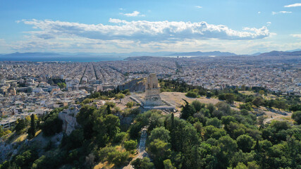 Aerial drone photo of magnificent monument on top of Filopapos hill or Filopappou with views to Acropolis hill and seaside Athens, Attica, Greece