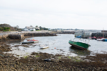 Beautiful bay with boats during low tide in Ireland