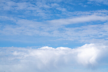 White clouds against the blue sky.