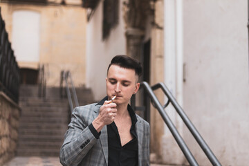 Fototapeta premium young businessman doing everyday things on the street