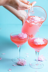 Rosé cocktails  with a flower garnish