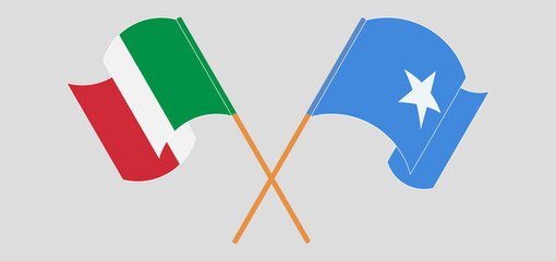 Crossed and waving flags of Italy and Somalia