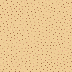 Polka dot fabric. An infinite number of brown dots on a beige background. Seamless coffee shade pattern for textiles, wrapping paper, pillows, bedding. Vector graphics.
