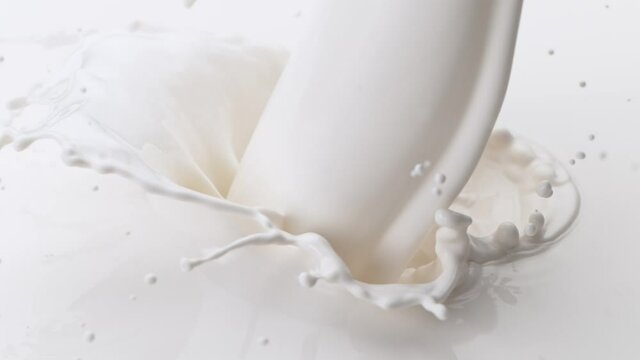Super Slow Motion Detail Shot of Pouring and Splashing Fresh Cream at 1000 fps.