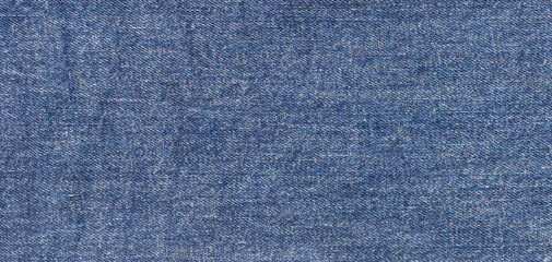 Naklejka premium texture of blue jeans denim fabric background 