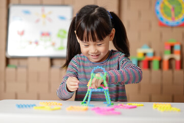 young girl playing creative blocks for homeshcooling