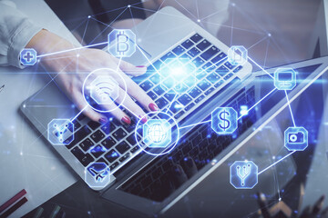 Double exposure of woman hands typing on computer and social network theme hologram drawing. People media concept.