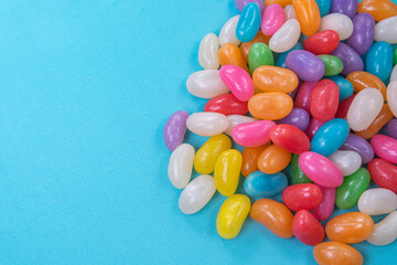 Various jelly beans on the blue background