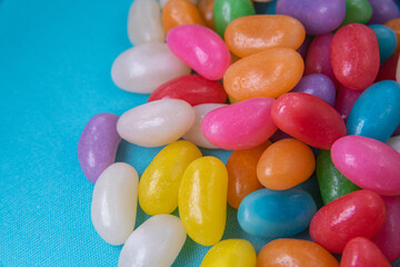 Various jelly beans on the blue background