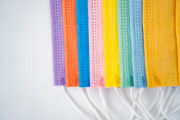 multicoloured protective masks on a white background
