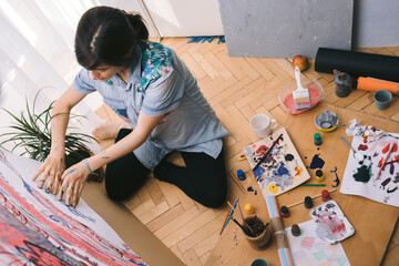 Female artist paint with hands. Creative activity and inspiration concept. Talented people concept.