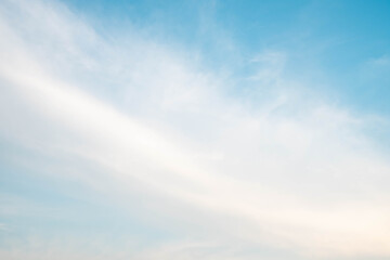 Fototapeta premium beautiful white clouds and sunlight on the blue sky perfect for the background, taken in the evening