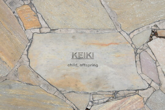 Hawaiian tiles embedded in the sidewalk of Kalakaua Avenue in Waikiki 