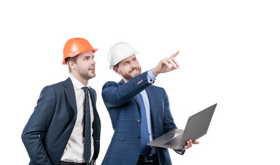 architects planning work. chief engineer and executive in hardhat use computer. ernet security. businessmen in helmet with laptop.