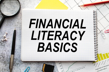 text Financial Literacy Basics, concept highlighted by handwritten text on back of an envelope.