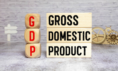 GDP word written on wood block. GDP text on wooden table for your desing, concept.