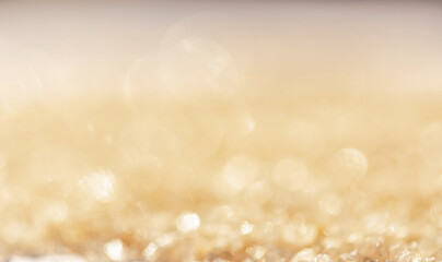 Blurred Bokeh background color gold abstract glitter lights.