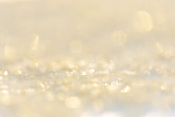 Blurred Bokeh background color gold abstract glitter lights.