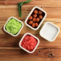 Ingredient of Es Bubur Sumsum or Es Bubur Lemu Bandung, Popular Traditional Porridge from West Java, Made from Rice Flour, Candil (Sticky Rice Ball), and Tapioca Pearl. Served with Palm Sugar Syrup an